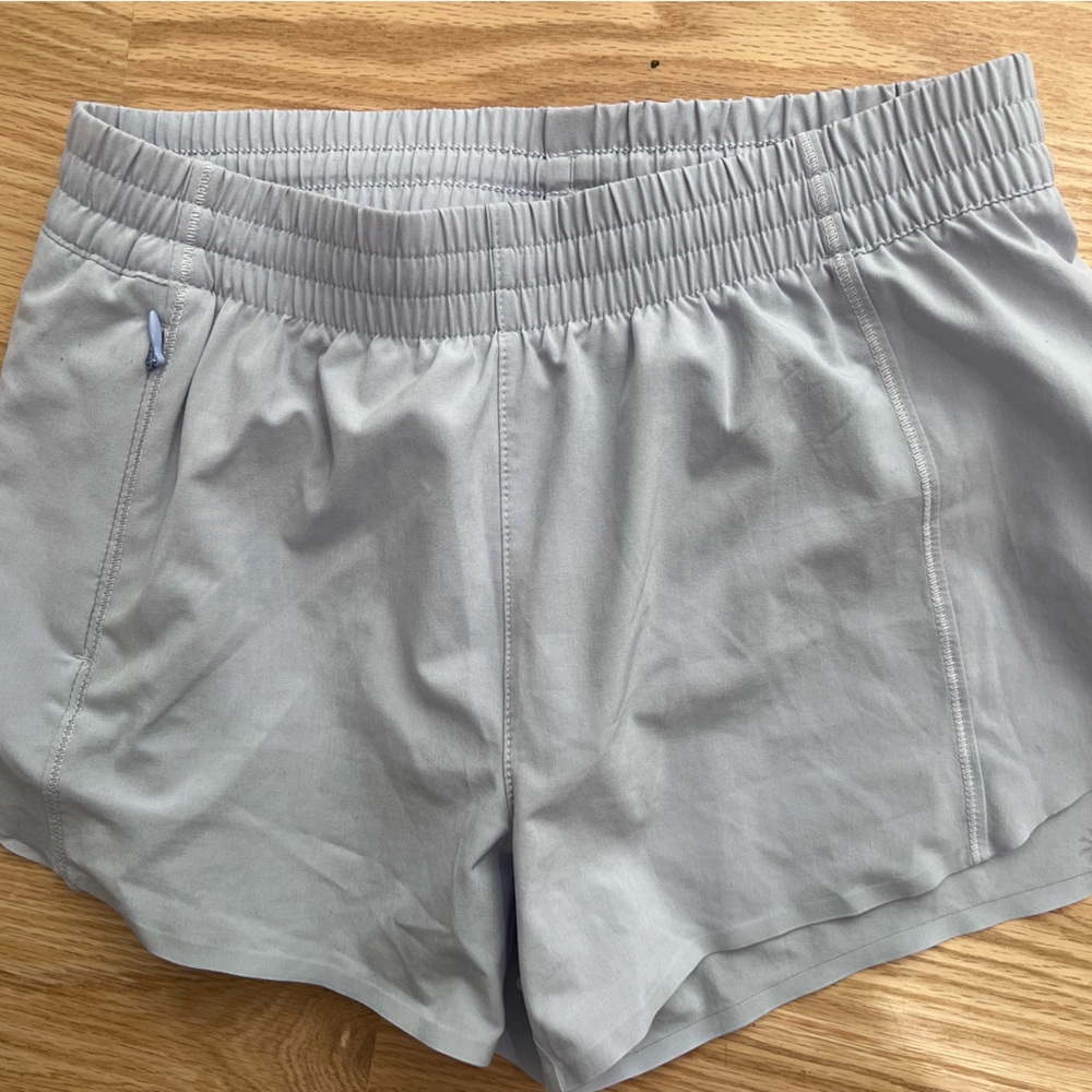 Athleta Girl Heart the Hustle 2.5 shorts. Periwinkle blue/purple/gray
